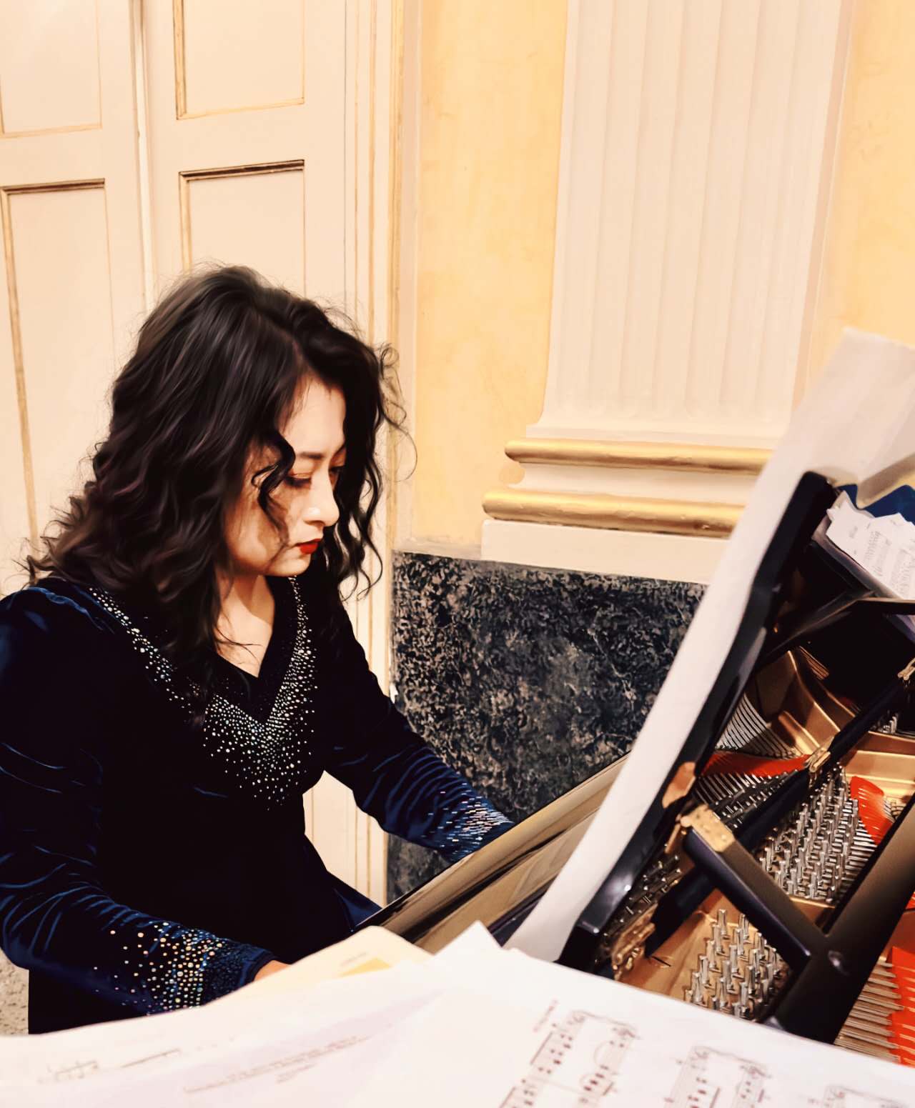 At the piano, with the score
